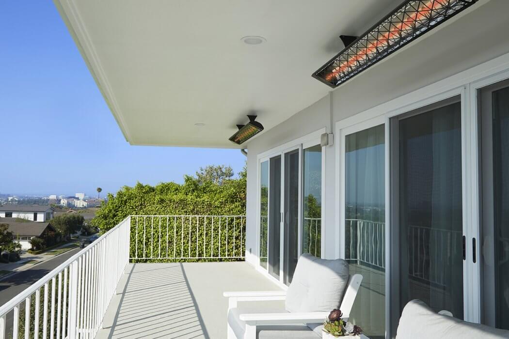 infratech motif heater with decorativeface plate installed in the ceiling of a balcony